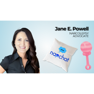 Jane E. Powell smiling with a “napchat” pillow and pink baby rattle icon, representing her pregnancy update video on narcolepsy and motherhood.