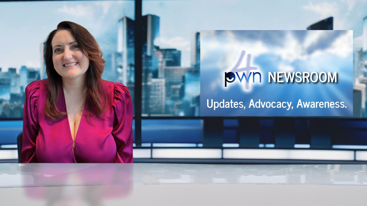 Woman smiling in newsroom